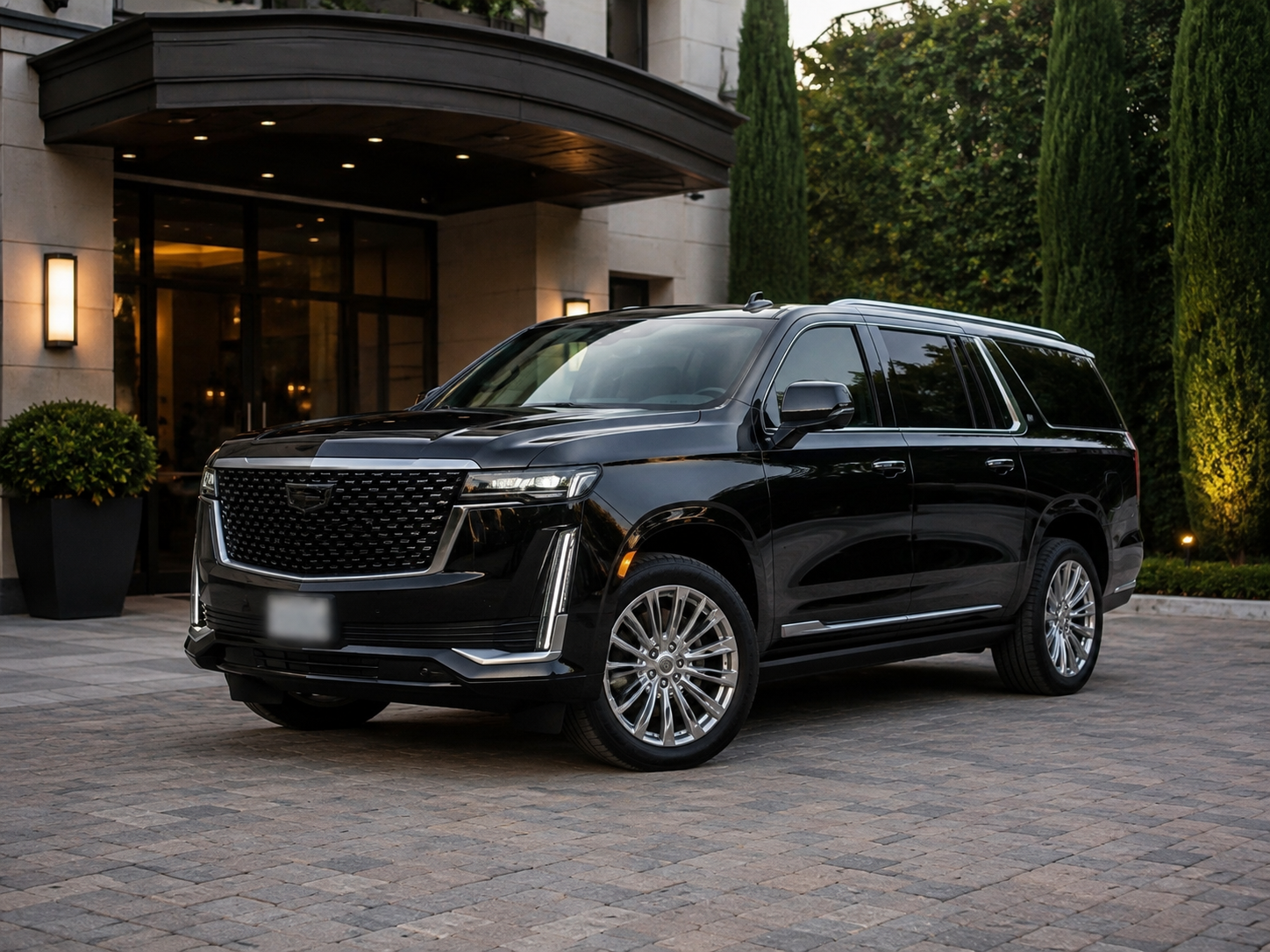 Luxury black SUV with privacy-blurred license plate